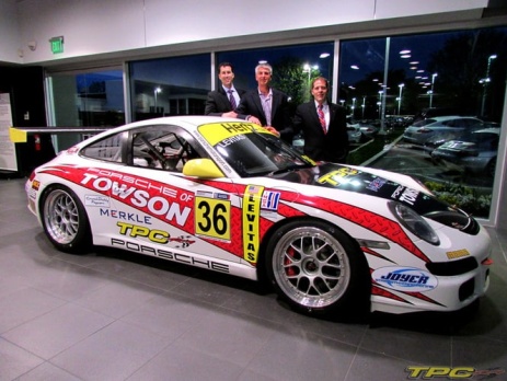 Mike Levitas of TPC Racing posing with his GT3 Cup Car at Porsche of Towson