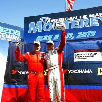 Michael Levitas and David Williams of TPC Racing on podium at Laguna Seca, IMSA Porsche GT3 Cup Challenge 2013